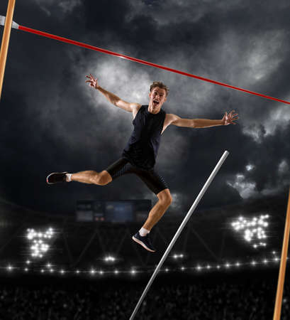 Professional pole vaulter celebration winner. Copy space backgroundの写真素材