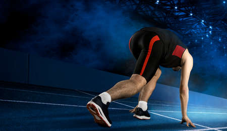 Runner feet running on running track close up on shoe. Concept of sport, movement, energy, dynamic, healthy lifestyleの写真素材