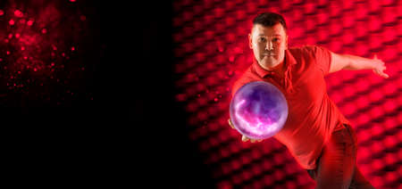 Professional bowling player in action. Concept of sport, movement, energy, dynamic, healthy lifestyleの写真素材