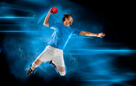 Handball player players in action. Handball concept on dark blue background