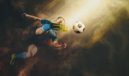 Soccer player in action on smoke backgroundの写真素材