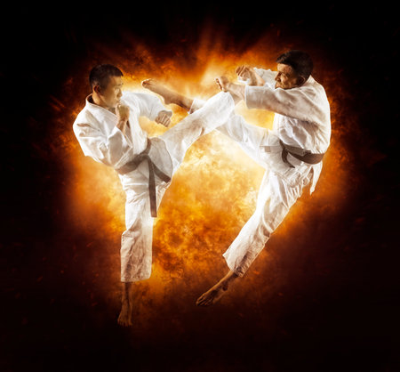 Martial arts masters, karate practice. flame backgroundの写真素材