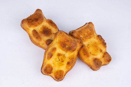 fresh sponge cookies in the form of bears on a white background
