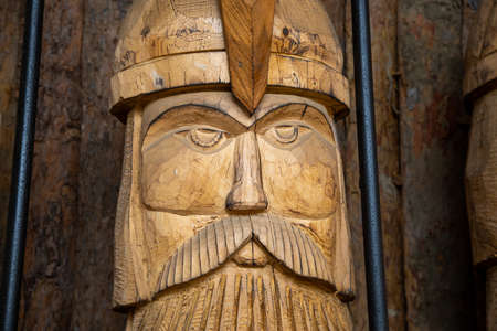 the face of an ancient warrior made of woodの写真素材