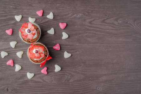 festive muffins on a wooden backgroundの写真素材