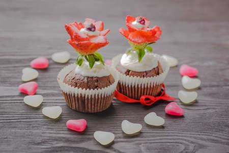 festive muffins on a wooden backgroundの写真素材