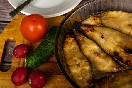 Halibut steaks baked in a glass dish. In soy sauce with honey.