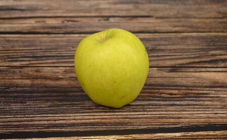 Ripe green Apple on wooden table background.の写真素材