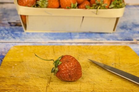 Strawberries with leaves. on a wooden table. Juice strawberryの写真素材
