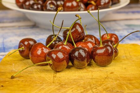 Sweet cherry macro photography close up. Antioxidant, natural, organic, vitamin berry. Selective focus. Drops of water on the surface of berries. Macro backgroundの写真素材