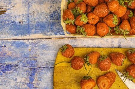 Strawberries with leaves. on a wooden table. Juice strawberryの写真素材
