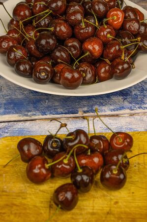 Sweet cherry macro photography close up. Antioxidant, natural, organic, vitamin berry. Selective focus. Drops of water on the surface of berries. Macro backgroundの写真素材