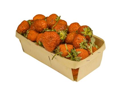 Delicious ripe strawberry in wooden basket isolated on white backgroundの写真素材