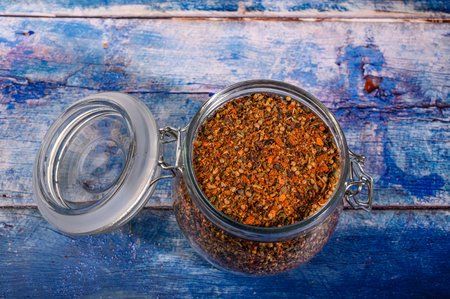 Fragrant spices in a glass jar with a lid and a metal lock. Close up