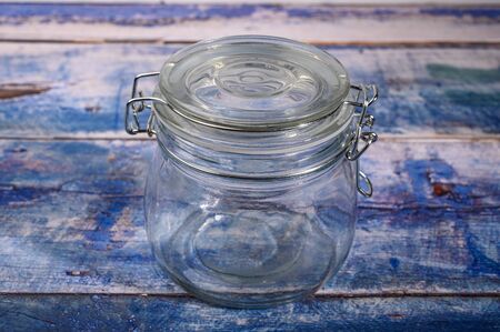 Glass jar with lid and metal lock for storing spicesの写真素材