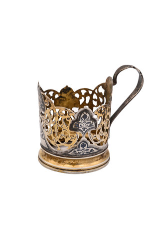 Old vintage Cup holder made of white metal. Close up. Isolate on a white backgroundの写真素材