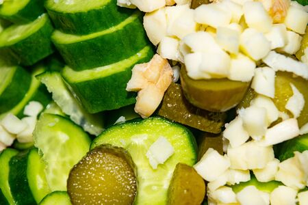 Vegetable salad sliced tomatoes, cucumbers, onions and pickles. Close up. Healthy food, fitness dietの写真素材