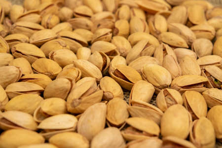 Salted pistachios lie on the burlap. Close upの写真素材