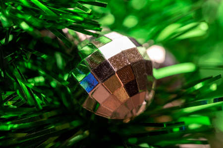 Shiny balloons and colorful tinsel elements of Christmas tree decoration, Close-up, selective focus. New year and christmasの写真素材