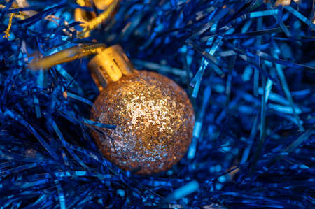 Shiny balloons and colorful tinsel elements of Christmas tree decoration, Close-up, selective focus. New year and christmasの写真素材