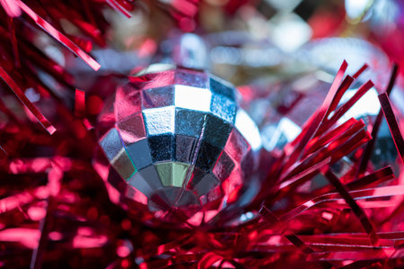 Shiny balloons and colorful tinsel elements of Christmas tree decoration, Close-up, selective focus. New year and christmasの写真素材
