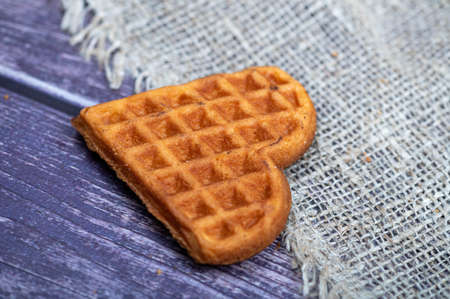 Delicious homemade cookies on the background of rough homespun fabric. Close-up, selective focusの写真素材
