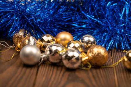 Shiny balloons and colorful tinsel elements of Christmas tree decoration, Close-up, selective focus. New year and christmasの写真素材