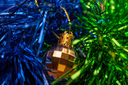 Shiny balloons and colorful tinsel elements of Christmas tree decoration, Close-up, selective focus....