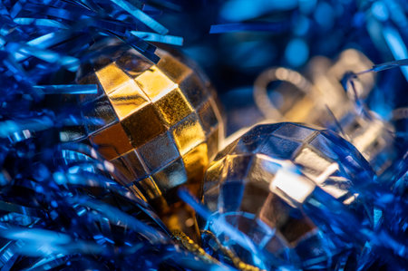 Shiny balloons and colorful tinsel elements of Christmas tree decoration, Close-up, selective focus. New year and christmasの写真素材