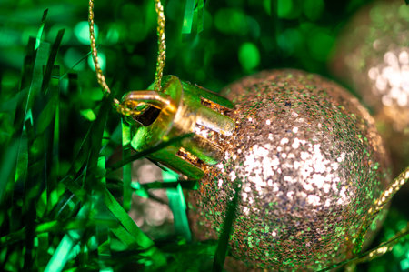 Beautiful glass balls and colored tinsel elements of Christmas tree decoration. New year and Christmas are your favorite holidays. Close-up, selective focusの写真素材