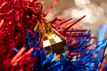 Beautiful glass balls and colored tinsel elements of Christmas tree decoration. New year and...