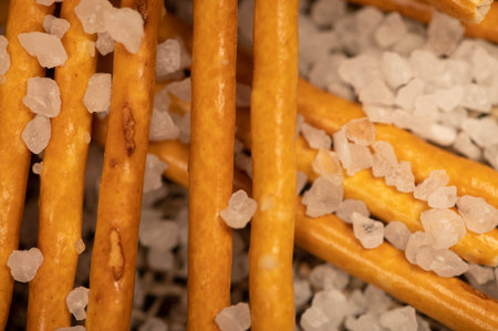 Salty bread strips spread out delicious snack surface texture. Close-up, selective focus.の写真素材
