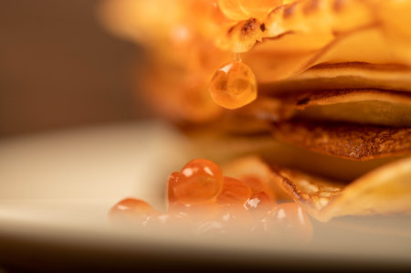 Traditional Russian pancakes with red salmon caviar. Shrovetide week of the meeting of spring....