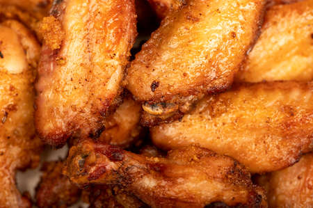Fried chicken wings on a plate, close-up, selective focusの写真素材