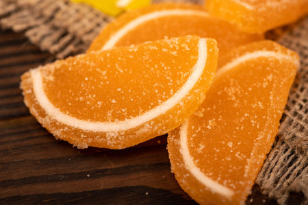 Multi-colored shaped marmalade lemon slices, close-up, selective focus