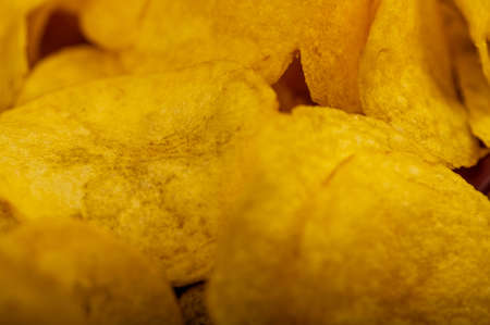 Potato chips scattered on the table, close-up, selective focusの写真素材