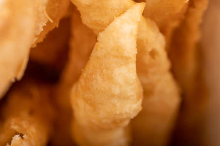 Fried breadsticks with salt, close-up, selective focusの写真素材