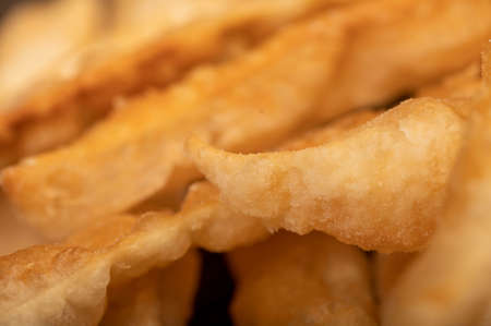 Fried breadsticks with salt, close-up, selective focusの写真素材