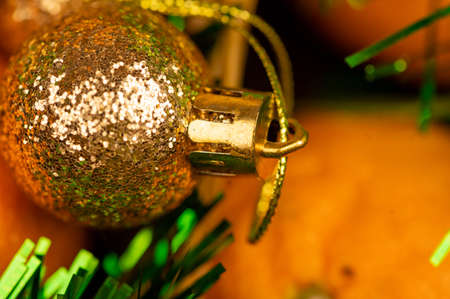 New Year and Christmas decorations of the festive table with tangerines, tinsel and Christmas balls. Close up, selective focusの写真素材