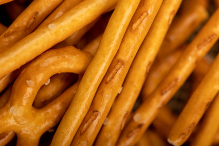 Crispy bread straws with salt, close-up, selective focus, top viewの写真素材