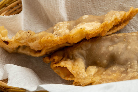 A homemade dish of Uzbek and Tatar cuisine, pasties with meat, suluguni cheese and herbs. Chebureks...