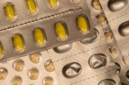 Different pills in blisters. Close-up, selective focus.の写真素材