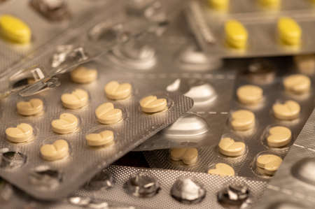 Different pills in blisters. Close-up, selective focus.の写真素材