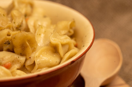 Boiled with spices dumplings with meat in a ceramic bowl. Close-up, selective focus.の写真素材