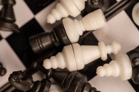 Chess pieces on a chessboard. Close-up, selective focus.