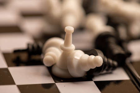 Chess pieces on a chessboard. Close-up, selective focus.の写真素材