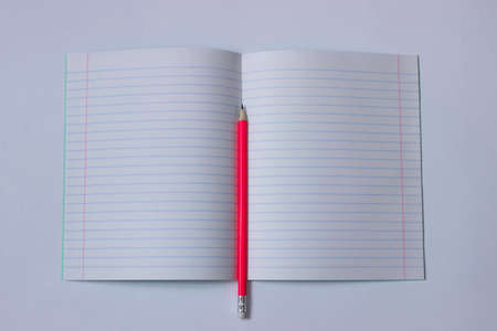 Pencil for writing on a white sheet of paper.の写真素材