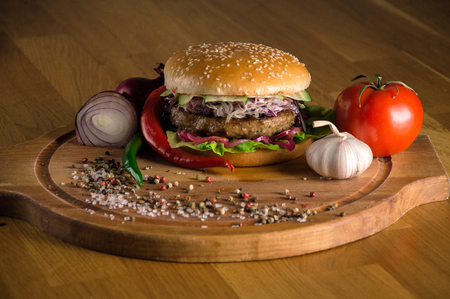 Delicious cheeseburger with fried beef chopsの写真素材