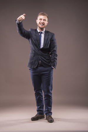 Charismatic man aiming a finger at the cameraの写真素材