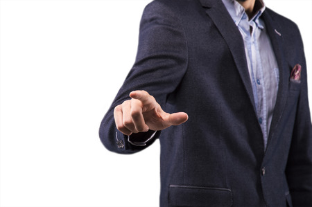 Man in a suit presses the finger on the displayの写真素材